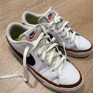 Nike White Sneakers with Black Swoosh and Brown Accent